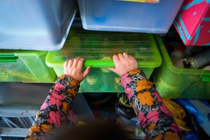 woman packing storage boxes in a storage container at The Hawthorns self-storage facility in Gloucestershire 